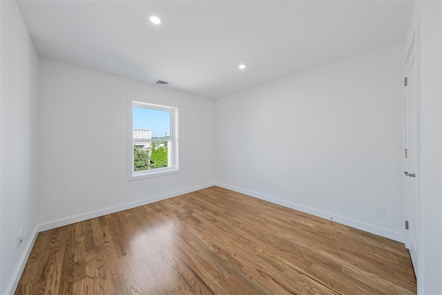 empty room with wood-type flooring