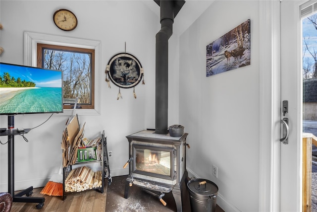 details with a wood stove and baseboards