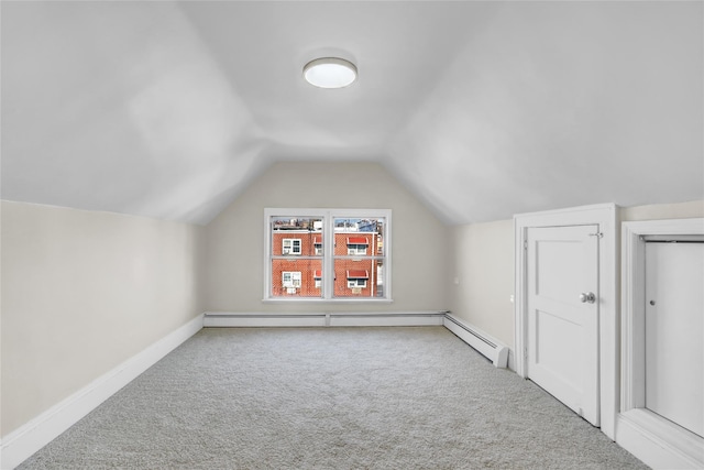 bonus room with carpet floors and vaulted ceiling