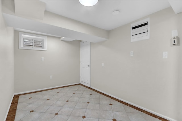 basement with light tile patterned flooring