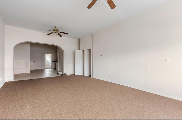 unfurnished room featuring ceiling fan and light colored carpet