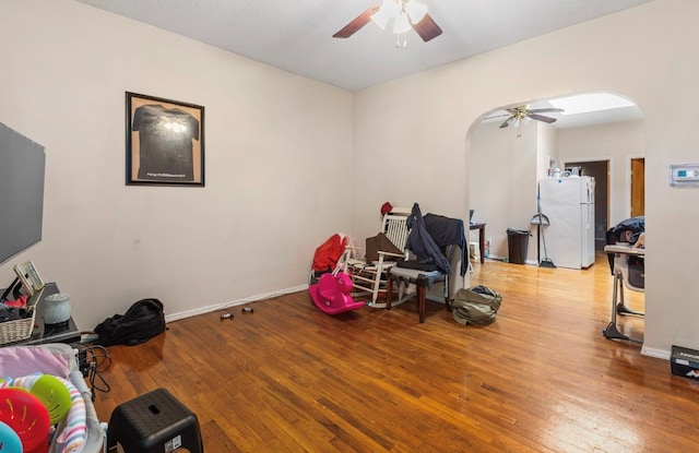 miscellaneous room featuring ceiling fan and light wood-type flooring