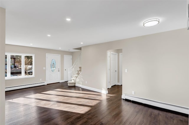 entrance foyer featuring a baseboard radiator and dark hardwood / wood-style flooring