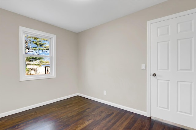 unfurnished room featuring dark hardwood / wood-style floors