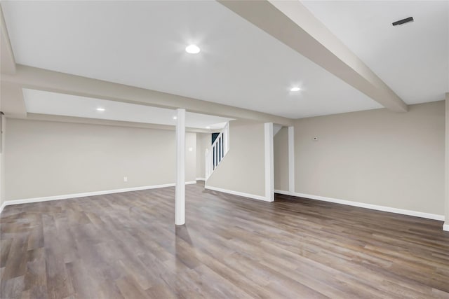 basement featuring hardwood / wood-style floors