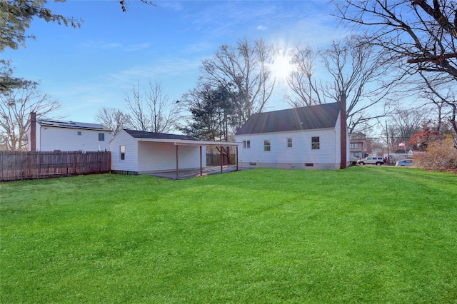 rear view of house with a lawn