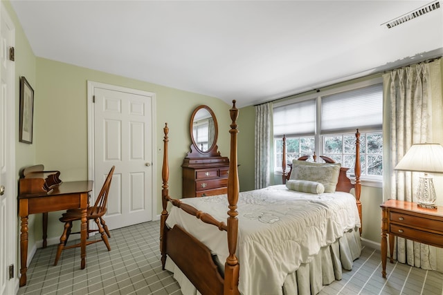 bedroom featuring light tile patterned floors