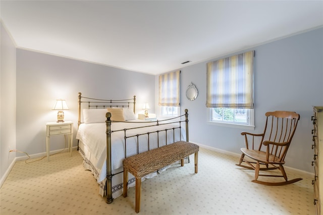 carpeted bedroom with crown molding