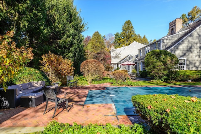 view of pool featuring a patio area and an outdoor living space