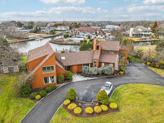 birds eye view of property featuring a water view