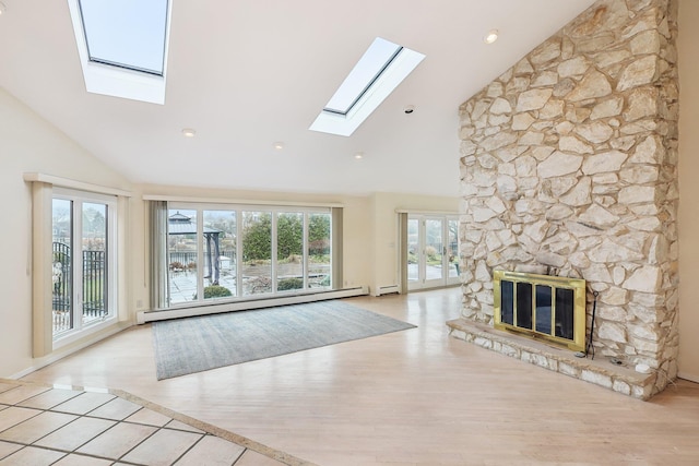 unfurnished living room with a stone fireplace, light wood-type flooring, high vaulted ceiling, and a baseboard heating unit