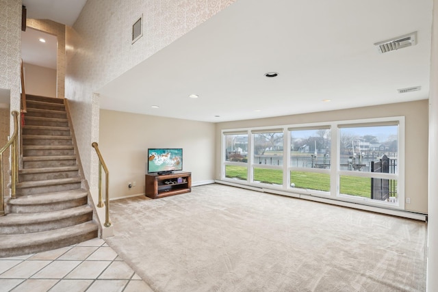 unfurnished living room featuring light tile patterned floors