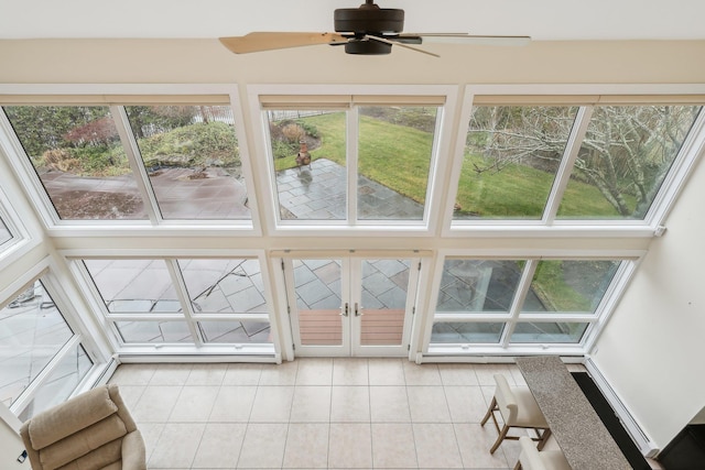 sunroom / solarium featuring ceiling fan