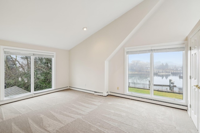 bonus room with a wealth of natural light, a water view, light carpet, and vaulted ceiling