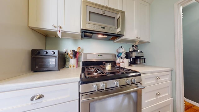 kitchen with white cabinets and stainless steel range with gas cooktop