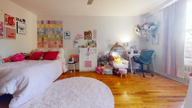 bedroom featuring ceiling fan and wood-type flooring