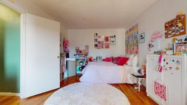 bedroom with wood-type flooring