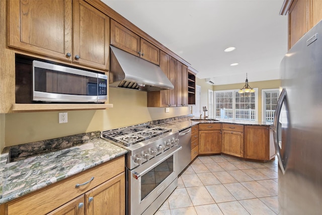 kitchen featuring sink, appliances with stainless steel finishes, decorative light fixtures, light tile patterned flooring, and light stone counters