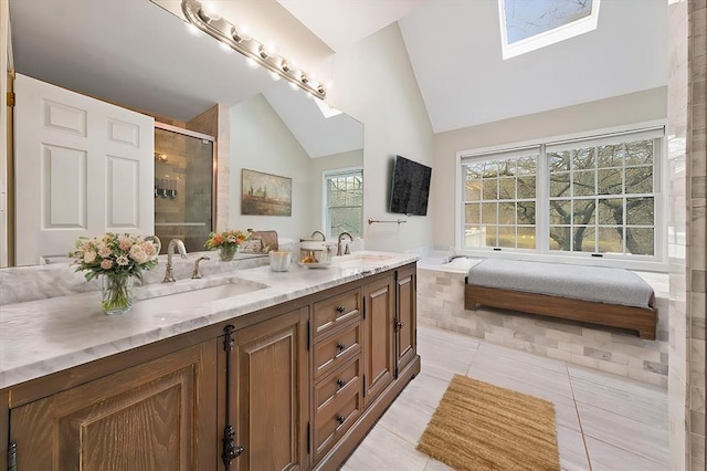 bathroom featuring tile patterned flooring, vanity, an enclosed shower, and lofted ceiling with skylight