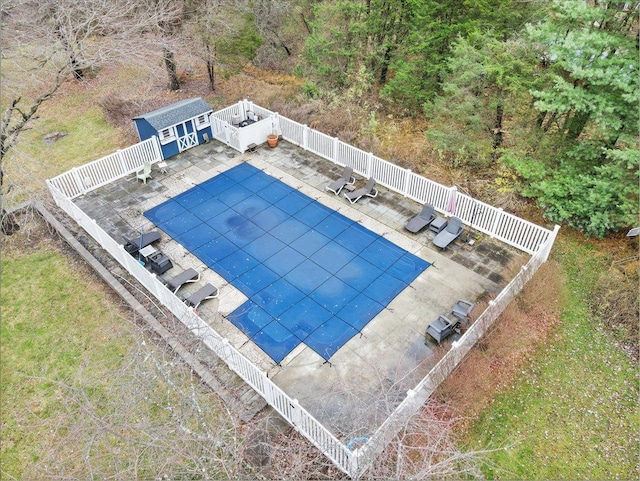 view of swimming pool with an outbuilding