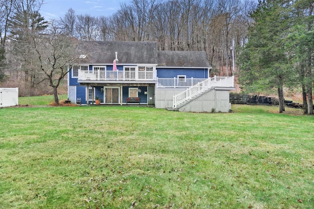 back of house with a yard and a wooden deck