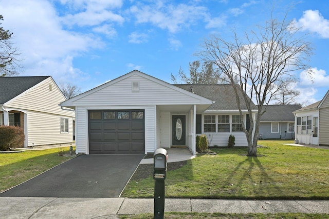 single story home featuring a front yard and a garage