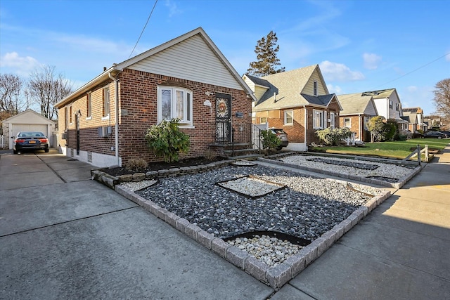 bungalow with an outbuilding and a garage