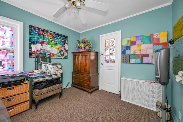 carpeted bedroom with ceiling fan, crown molding, and radiator