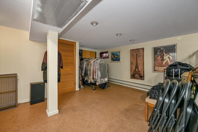 spacious closet with a baseboard radiator