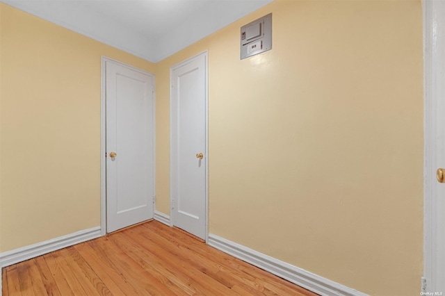 spare room featuring light hardwood / wood-style flooring