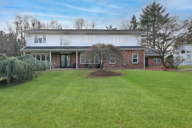 view of front of property with french doors and a front yard