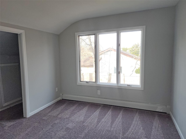 bonus room featuring baseboard heating, carpet, and vaulted ceiling