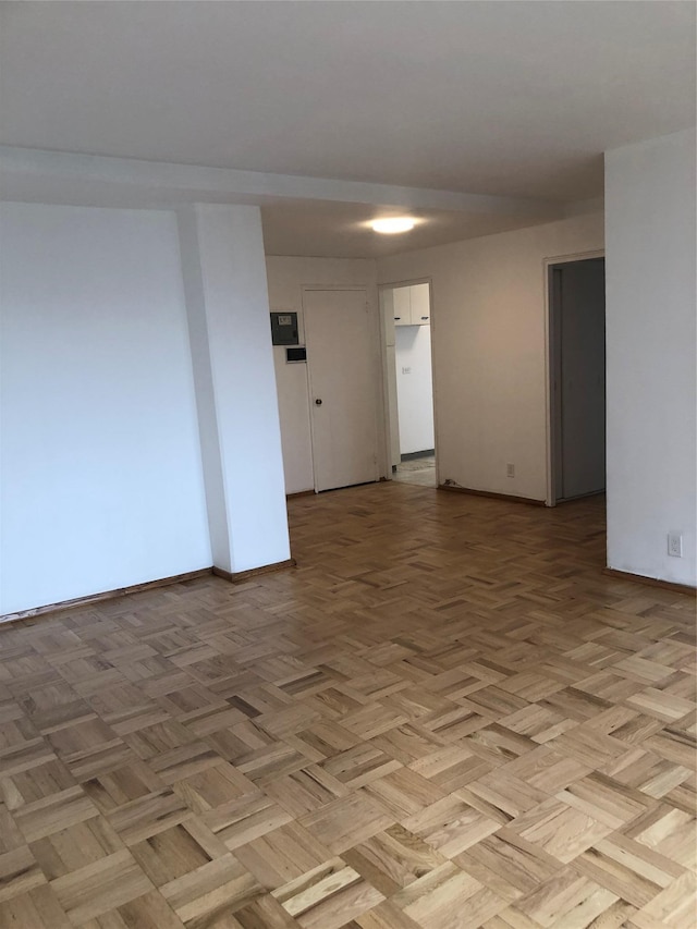 empty room with light parquet floors