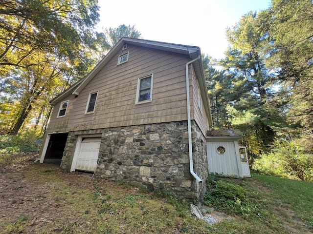 view of property exterior featuring a garage