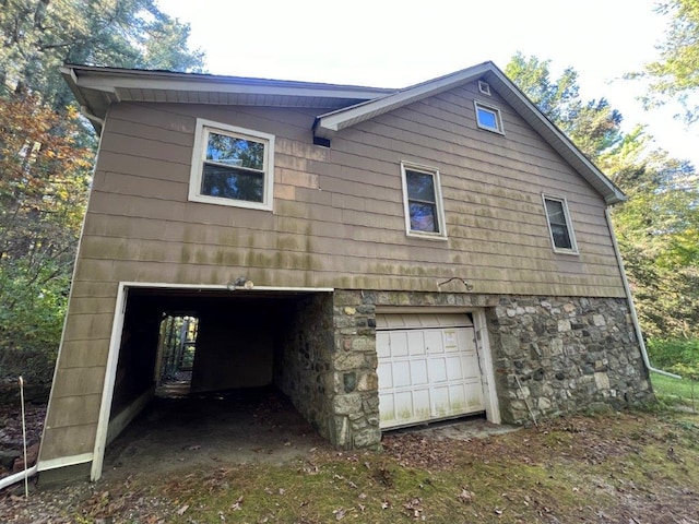 view of side of property featuring a garage