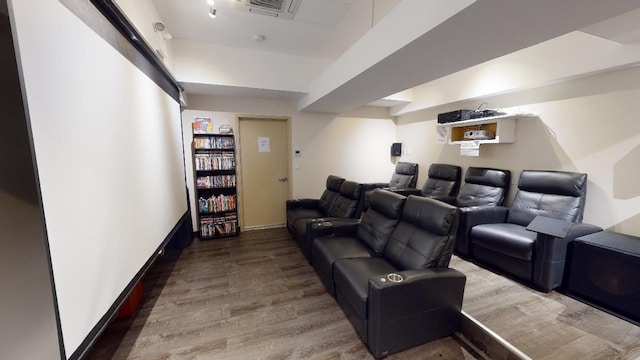 cinema room with wood-type flooring