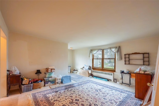 interior space featuring radiator and light carpet