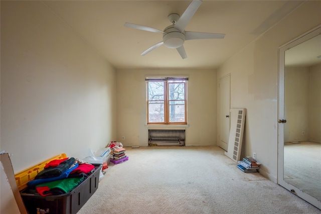 game room featuring ceiling fan and light carpet