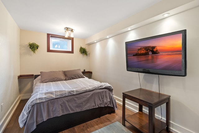 bedroom with hardwood / wood-style floors