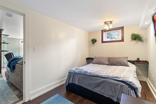 bedroom featuring dark hardwood / wood-style flooring