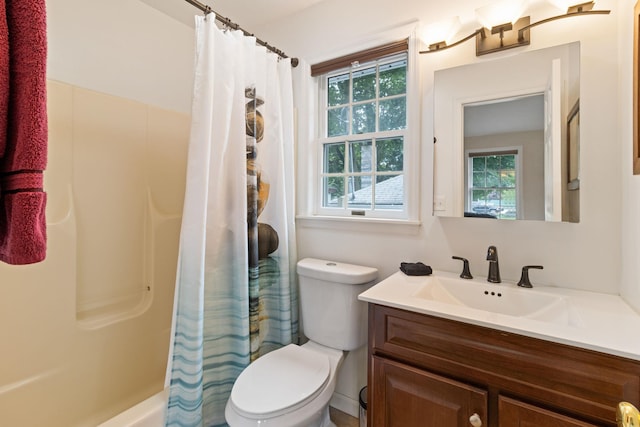 full bathroom with shower / bath combo, vanity, and toilet