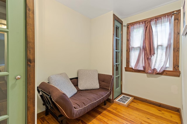 sitting room with hardwood / wood-style floors