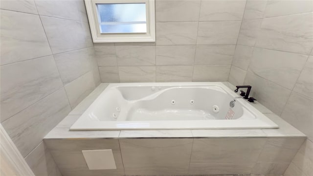 bathroom with tiled tub