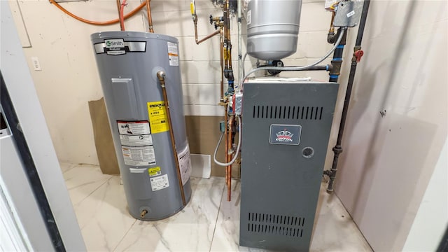 utility room featuring water heater