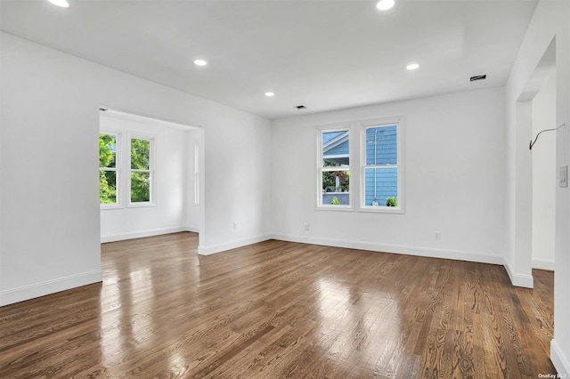 spare room with dark hardwood / wood-style flooring