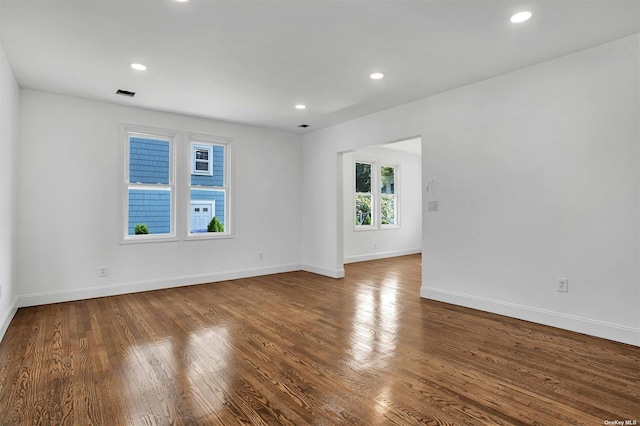 unfurnished room featuring hardwood / wood-style flooring