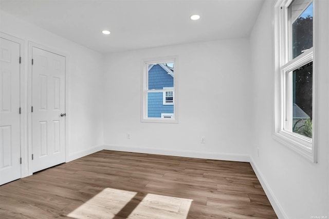 spare room featuring hardwood / wood-style floors