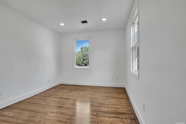 spare room featuring hardwood / wood-style flooring