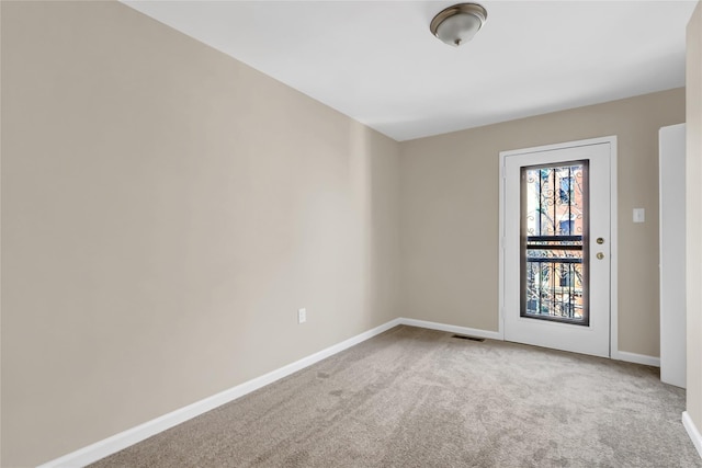 empty room featuring carpet flooring