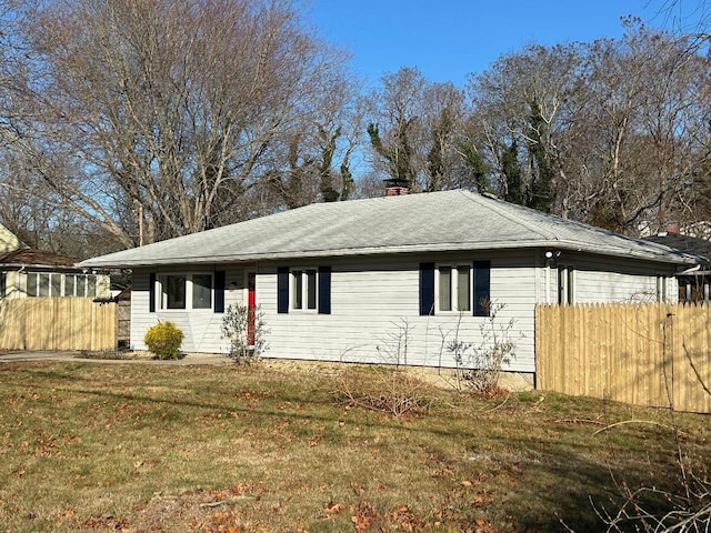 view of property exterior featuring a lawn